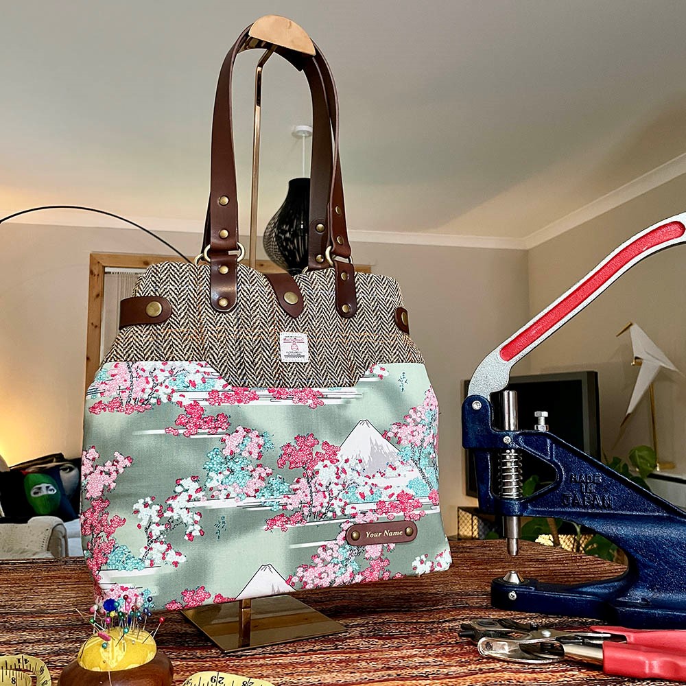 bag-making workshop with Oskar. Image shows bespoke handbag made from a fusion of Japanese fabric and Harris Tweed with leather straps and bottom