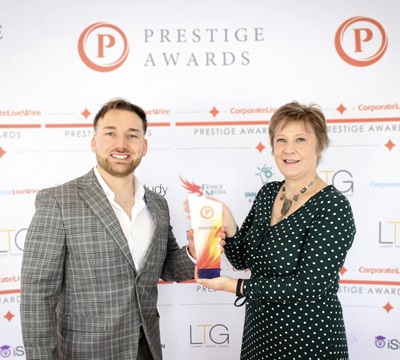 Jen being presented with her award at the Scotland Prestige Awards 2023/24